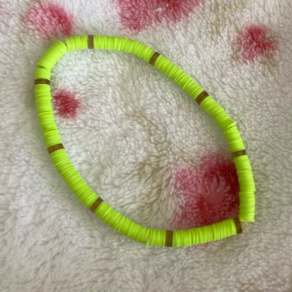 Bright neon green beaded bracelet.